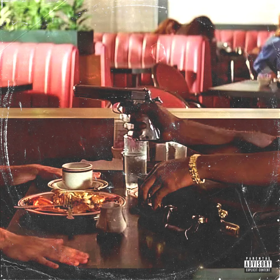 Album cover: a diner booth, one hand pointing a pistol across the table over a coffee cup and a plate of food, a gold bracelet on the other wrist